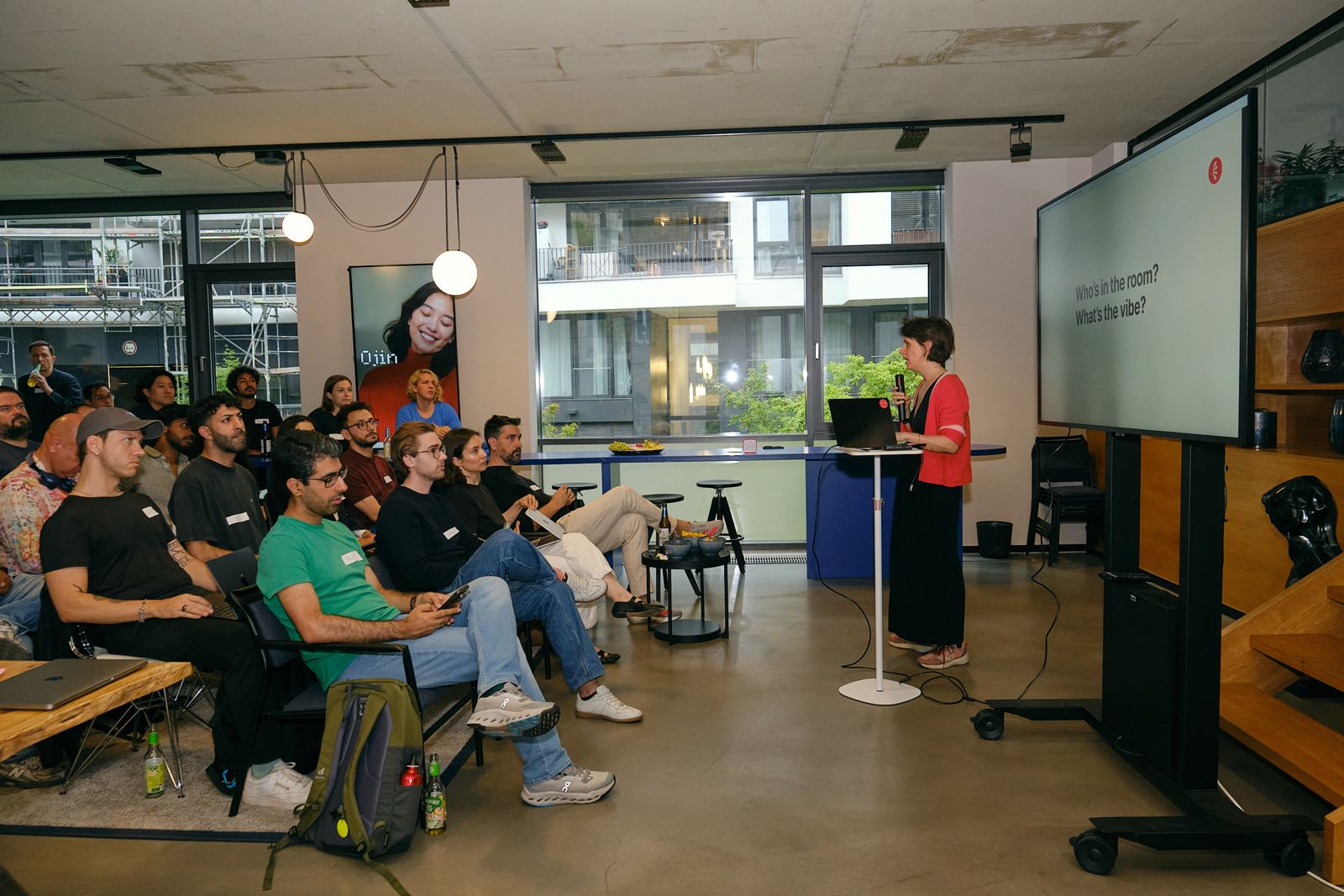 Margaux Pelen at the screen with a seated group at One Last Prompt 2, Berlin